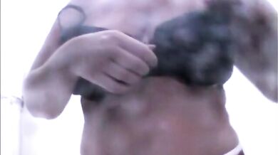 Busty Stepmom takes off bikini and showers