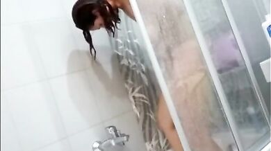 peeping at Stepmom as she trims her bush